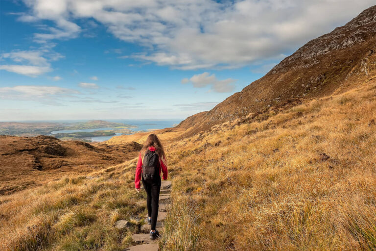 woman walking in connemara, beautiful scnerny